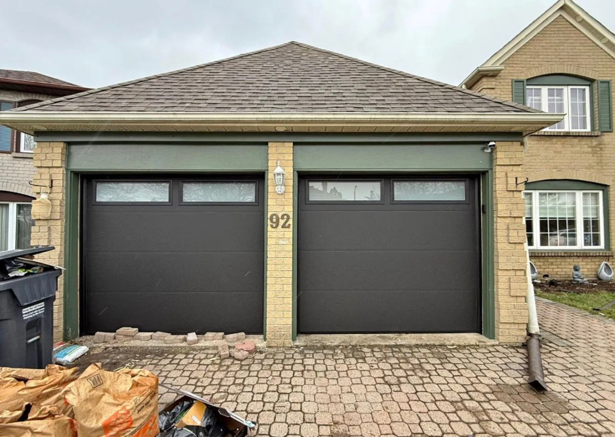 Double garage doors with green trim